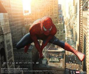 The superhero Spiderman leaping between the buildings in the city swinging  with his spider web puzzle & printable jigsaw