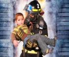 Firefighter holding a child in arms
