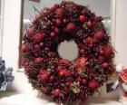 Christmas wreath with red fruits