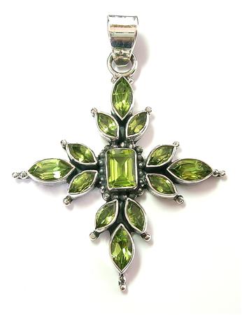 this holy puzzel holds a beautiful cross with the birthstone of August- the Peridot puzzle